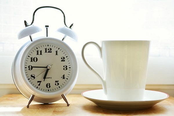 Alarm clock and coffee.